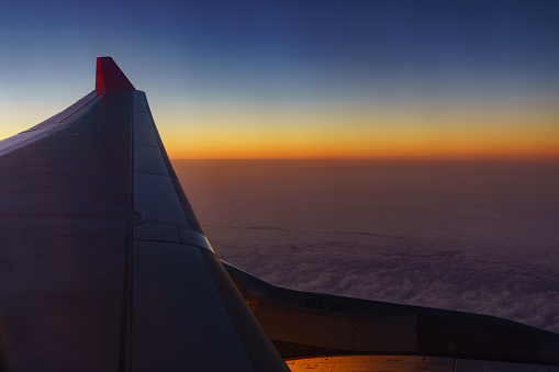 Airplane wing with beautiful sunset