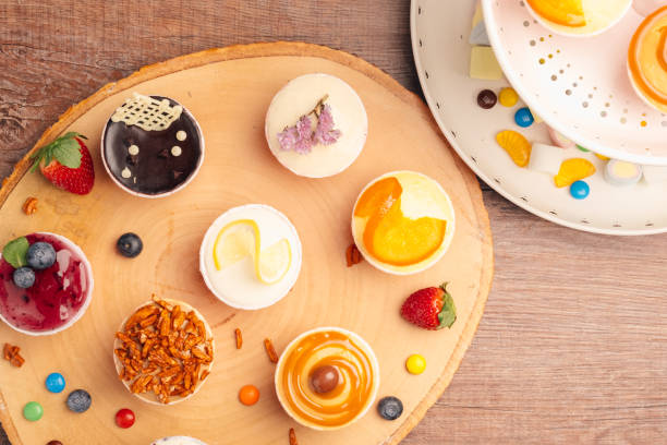 istock Delicious cupcakes with berries on white table, top view 822376478