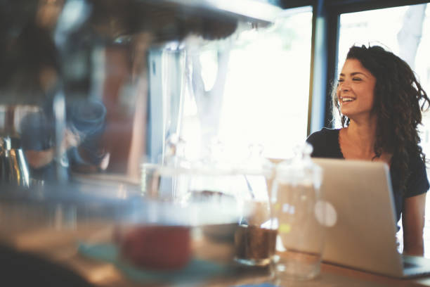 istock Young woman laughing in cafe 822380986