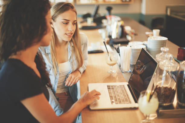 istock Girls typing on laptop in cafe 822380996