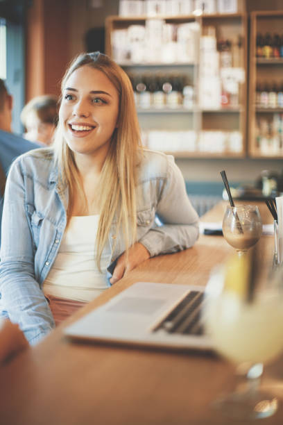 istock Young blonde girl sitting in cafe 822381018