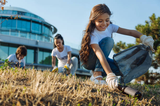 istock Delighted little girl working in volunteer group 822385258