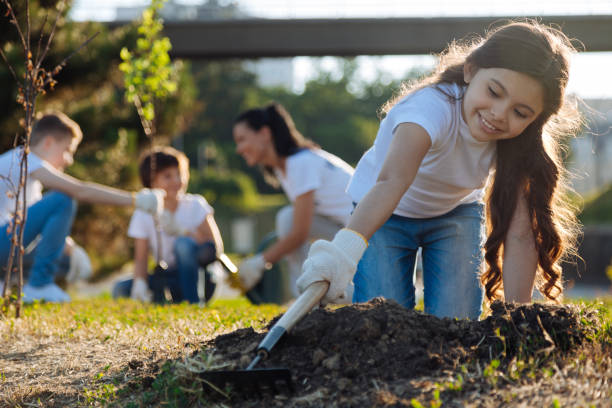 istock Charming little volunteer working with rate 822398088