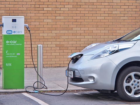 Dublin, Ireland - June 3, 2017: Electric Vehicle 'EV' charging electric power in battery at public charge point. Ecars operates and maintains 1,200 public charge points across the island of Ireland.