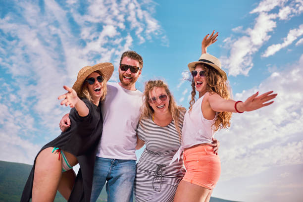 istock Group of people dancing at the beach party 822404042