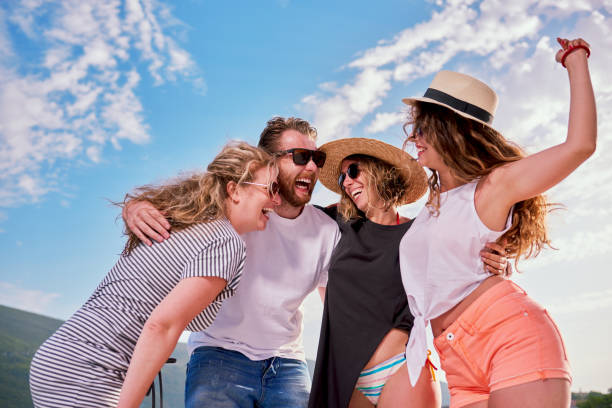 istock Group of people dancing at the beach party 822404074