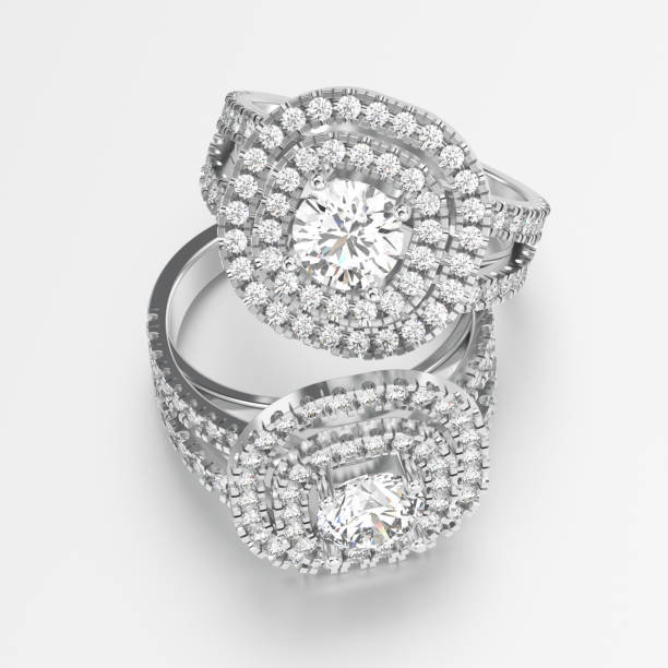 istock 3D illustration two white gold or silver rings with diamonds with reflection 822413440