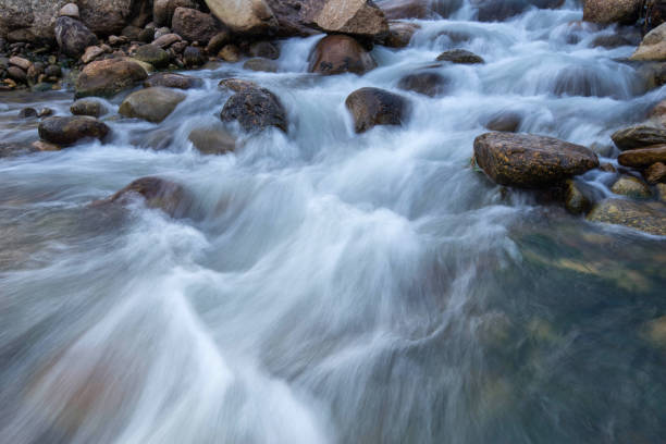 istock Background Waterfall rocks, Beautiful fall ,Thailand , nature 822415454