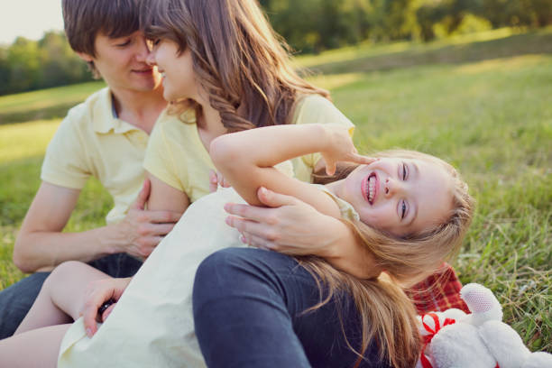 istock Happy family in summer park 822442412