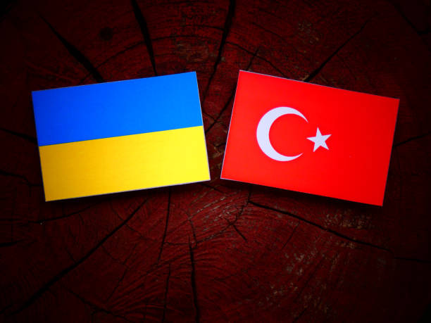 istock Ukraine flag with Turkish flag on a tree stump isolated 822444606