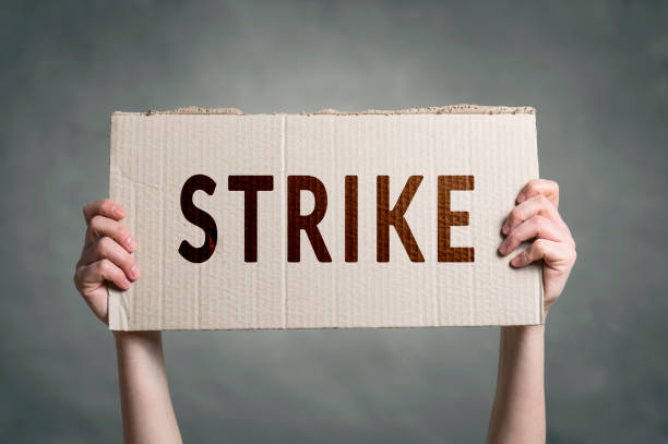 Workers going on Strike Hands holding protest signs. Workers going on Strike historical geopolitical location stock pictures, royalty-free photos & images