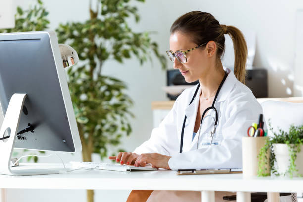 istock Female doctor working with laptop in the office. 822452392