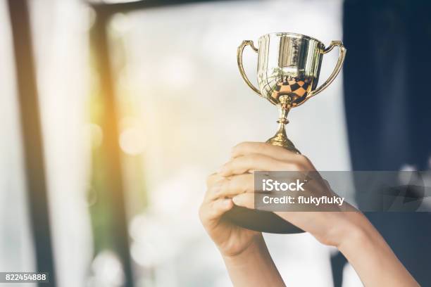 Teenage Girls Hands Are Holding Trophies Congratulations On Successconception Of Victory In The Competition Stock Photo - Download Image Now