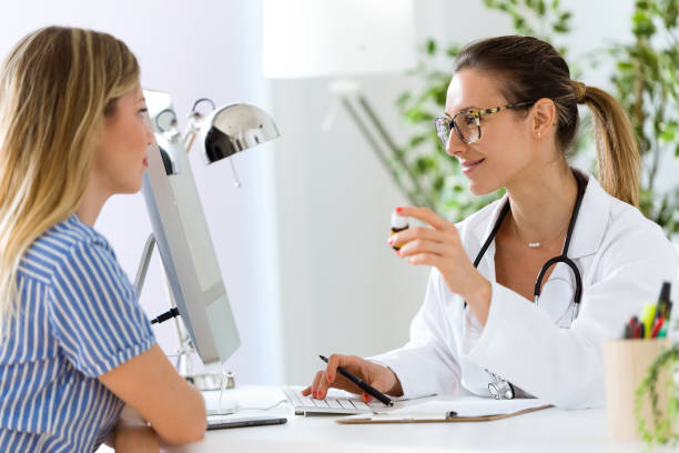 istock Female doctor prescribing medication for patient. 822455666