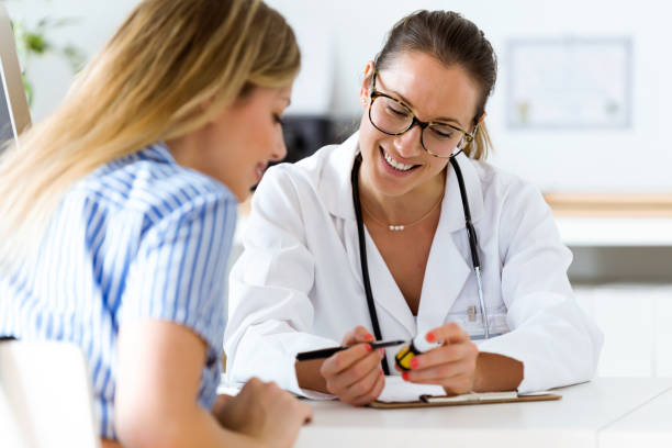 istock Female doctor prescribing medication for patient. 822456084