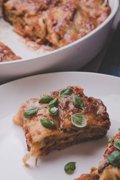 istock Delicious lasagna in white plates 822456364