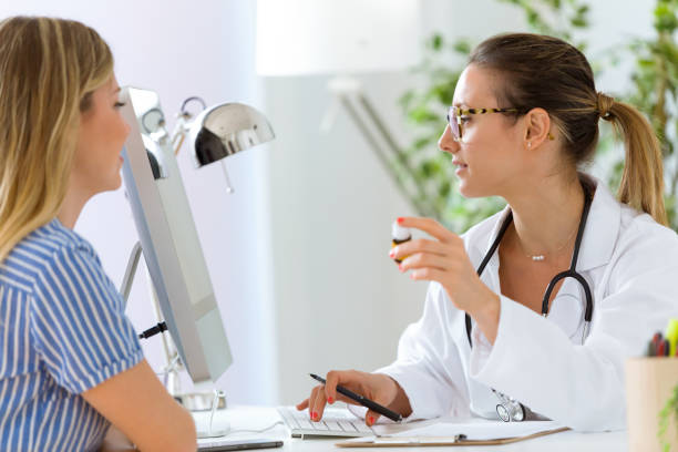 istock Female doctor prescribing medication for patient. 822456400
