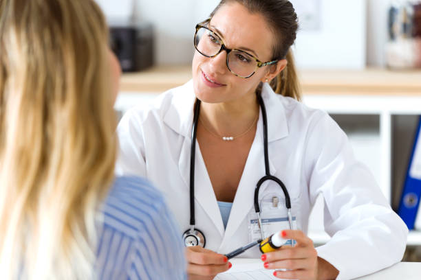 istock Female doctor prescribing medication for patient. 822456580