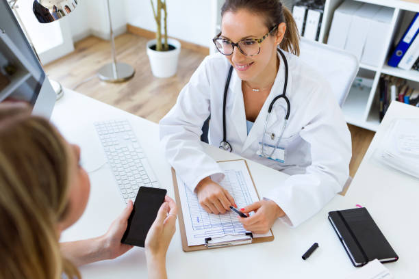 istock Female doctor explaining diagnosis to her patient. 822457524