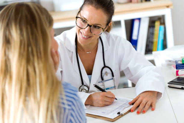 istock Female doctor explaining diagnosis to her patient. 822457700
