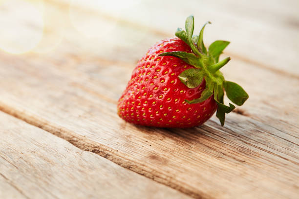 istock Fresh ripe strawberry on wooden table 822470262
