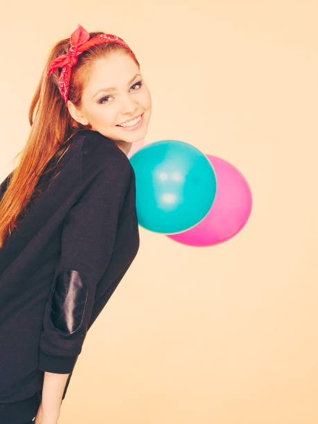 istock Smiling crazy girl having fun with balloons. 822473908