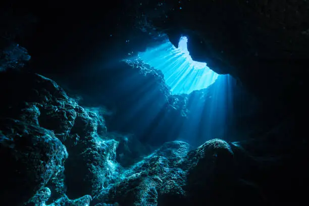 Rays of sunlight into the underwater cave in Miyakojima Island.