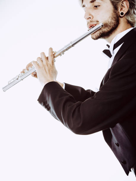 istock Male flutist wearing tailcoat plays flute 822474524