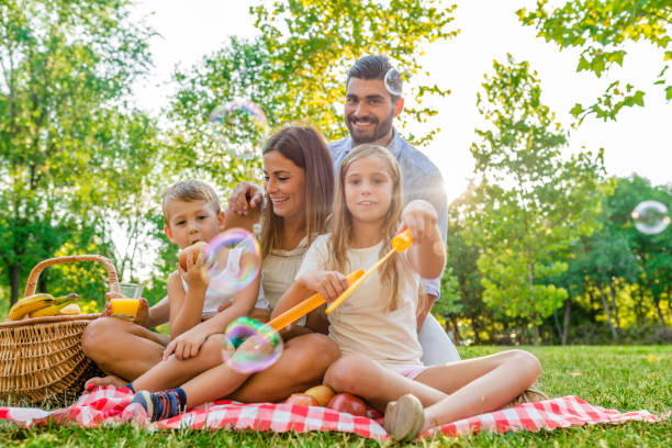 istock Smiling family spending a spring day on picnic 822499904