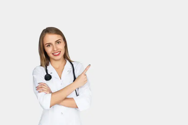 Photo of Female doctor holding arms folded pointing