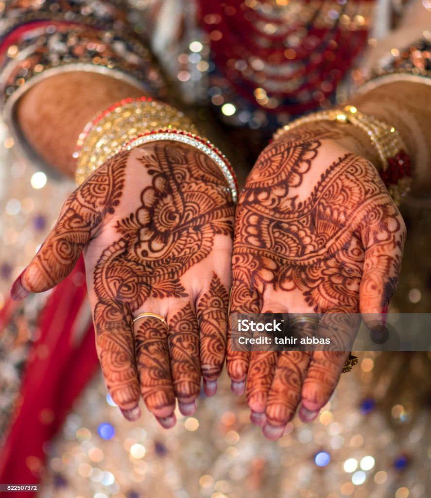 Mehndi on bride's hands Mehndi design Pakistan Stock Photo