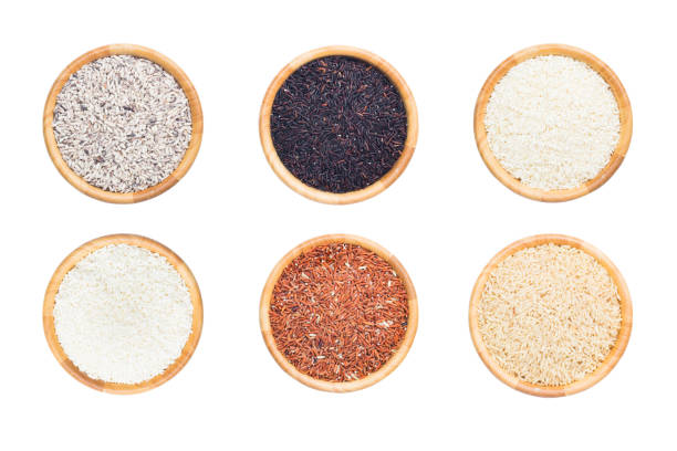 istock rice in wooden bowl on white background., 822510278