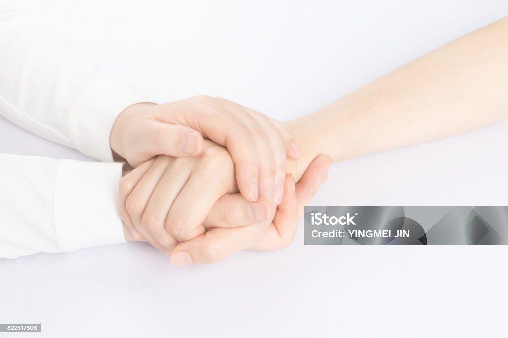 A helping hand Holding Hands Stock Photo