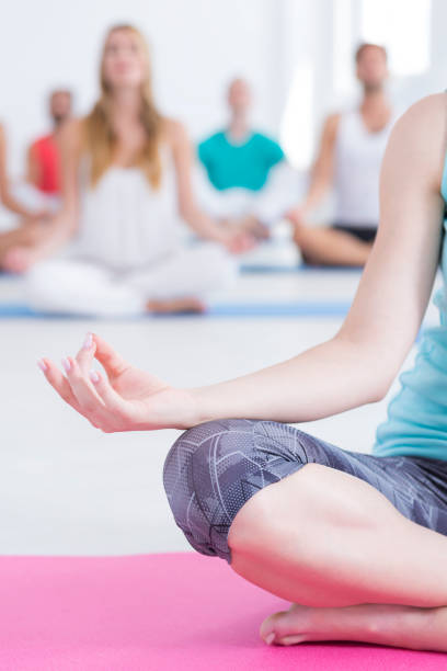 istock Woman meditating on mat 822525284