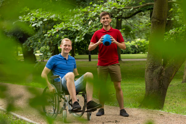 istock Disabled man playing sport with friend 822526676
