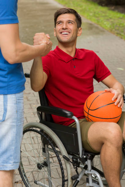 istock Happy disabled man holding a basketball 822526728