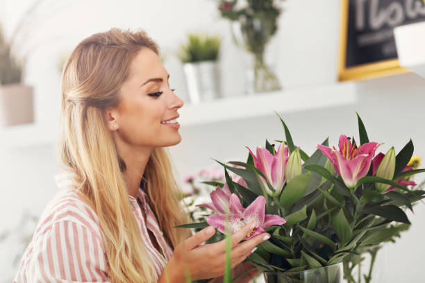 istock Female florist working in flower shop 822533010