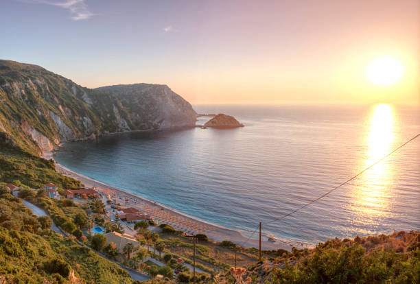 Petani beach at sunset, Kefalonia, Greece Petani Beach (also spelled Petanoi) is situated in the North West of the Paliki, in Kefalonia, Greece. lixouri stock pictures, royalty-free photos & images
