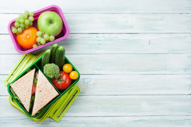 istock Lunch box with vegetables and sandwich 822548660