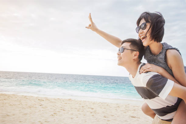 istock Young couple enjoying their summer vacation on beach 822550000