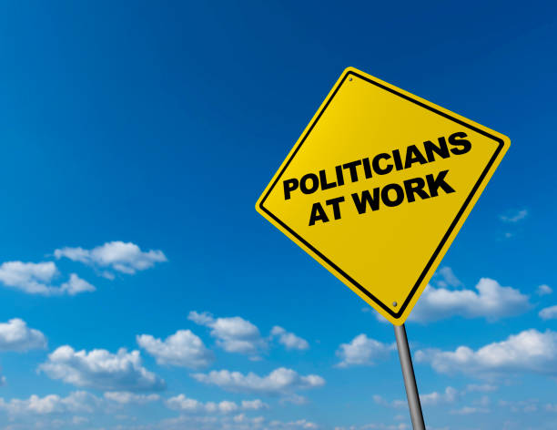 istock POLITICIANS AT WORK - Road Warning Sign 822556196