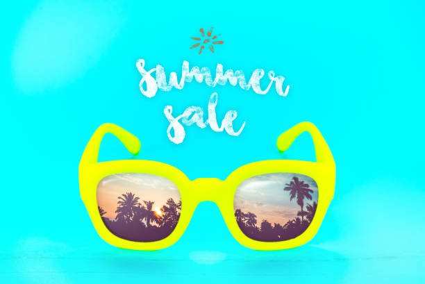 istock yellow sunglasses with reflection sunset at palm tree landscape scene with sea wave,Summer sale concept 822561640
