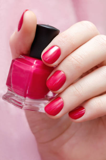 istock Beautiful female hand with pink nail design. 822572172