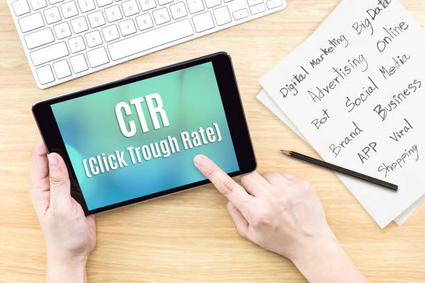 istock Hand using tablet with CTR ( Click trough rate ) word on screen with list of digital marketing features on paper on work table,Online business concept 822576472