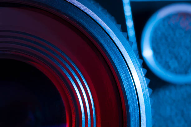 istock Closeup of retro camera lens with red and blue lighting 822586104