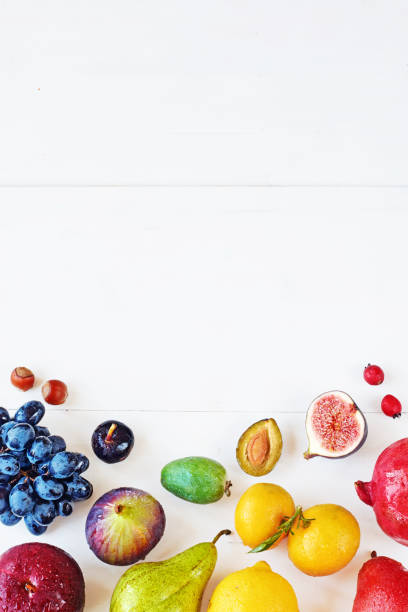 istock Rainbow colored fruits over white background with copy space. 822593688