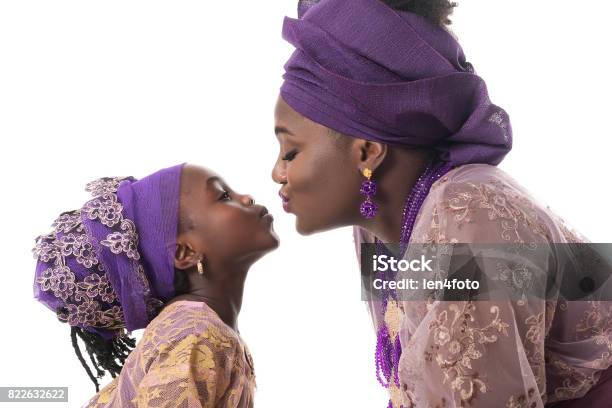 Mother And Child Girl Kissingafrican Traditional Clothing Isolated Stock Photo - Download Image Now