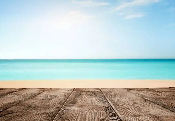 Photo of Old empty wooden pier over the turquoise ocean