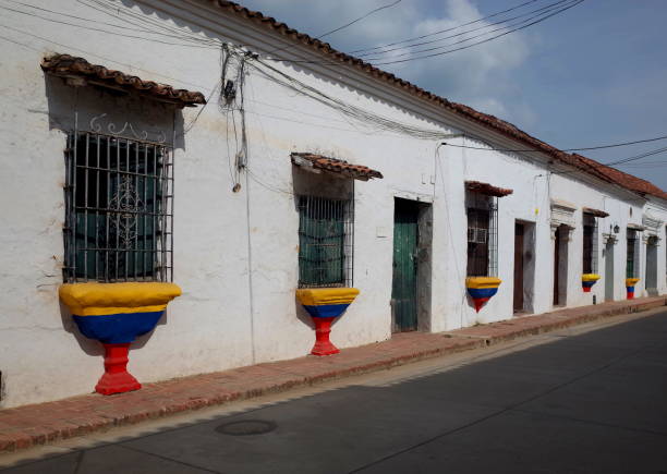 A street in Mompox with windows painted in the colours of the Colombian flag