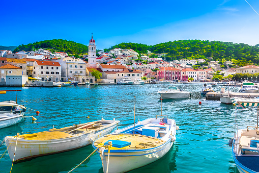 Seafront scenery of small mediterranean village Pucisca on Island Brac, tourist summer resort in Croatia, Europe.